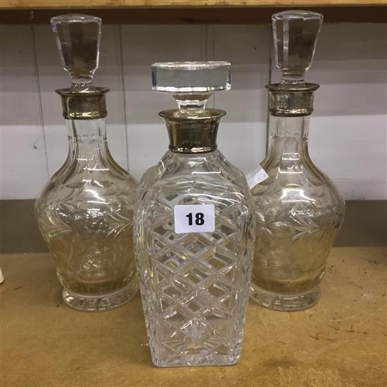 Three silver mounted decanters